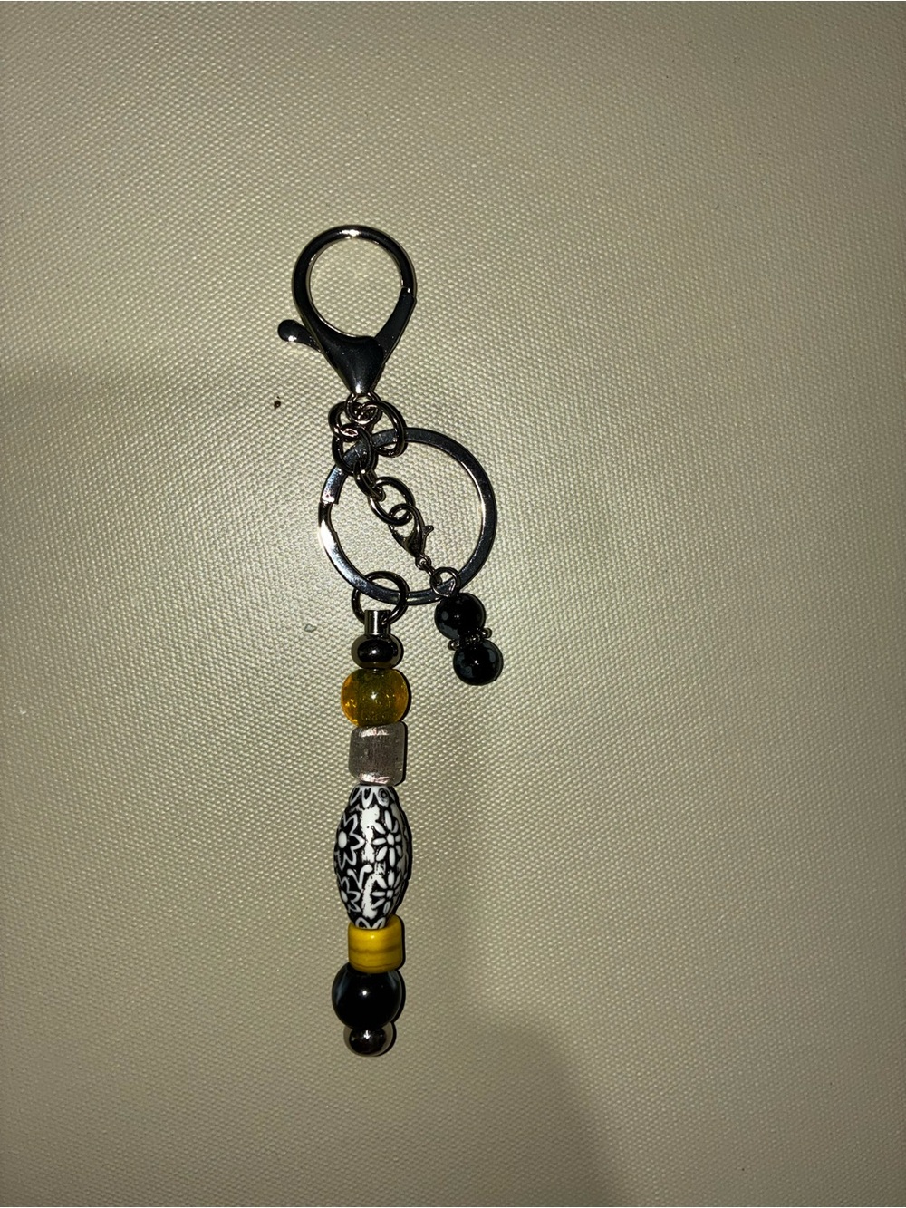 Sugar’s Handcrafted Creations Beaded Keychain Charm in Black, Yellow & Silver